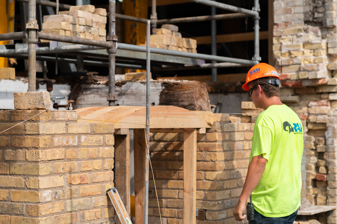 MILL0420_JackiePresentation_worker_masonry 1